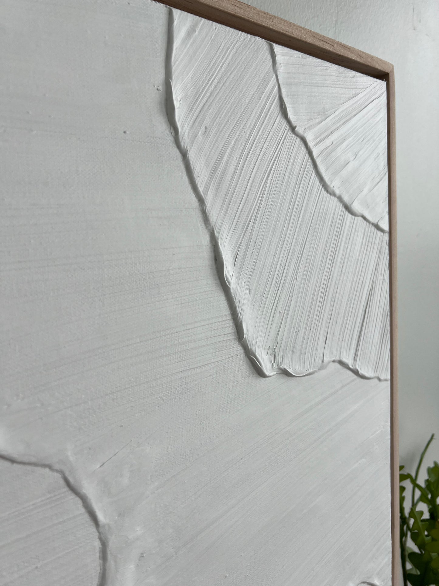 Abstract art piece with wavy lines on a textured surface