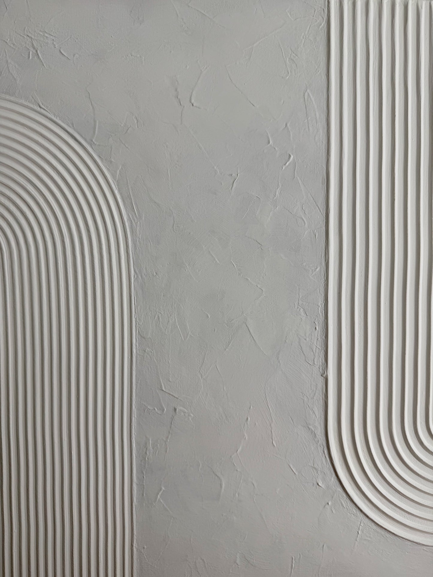 Gray textured wall with white curved lines