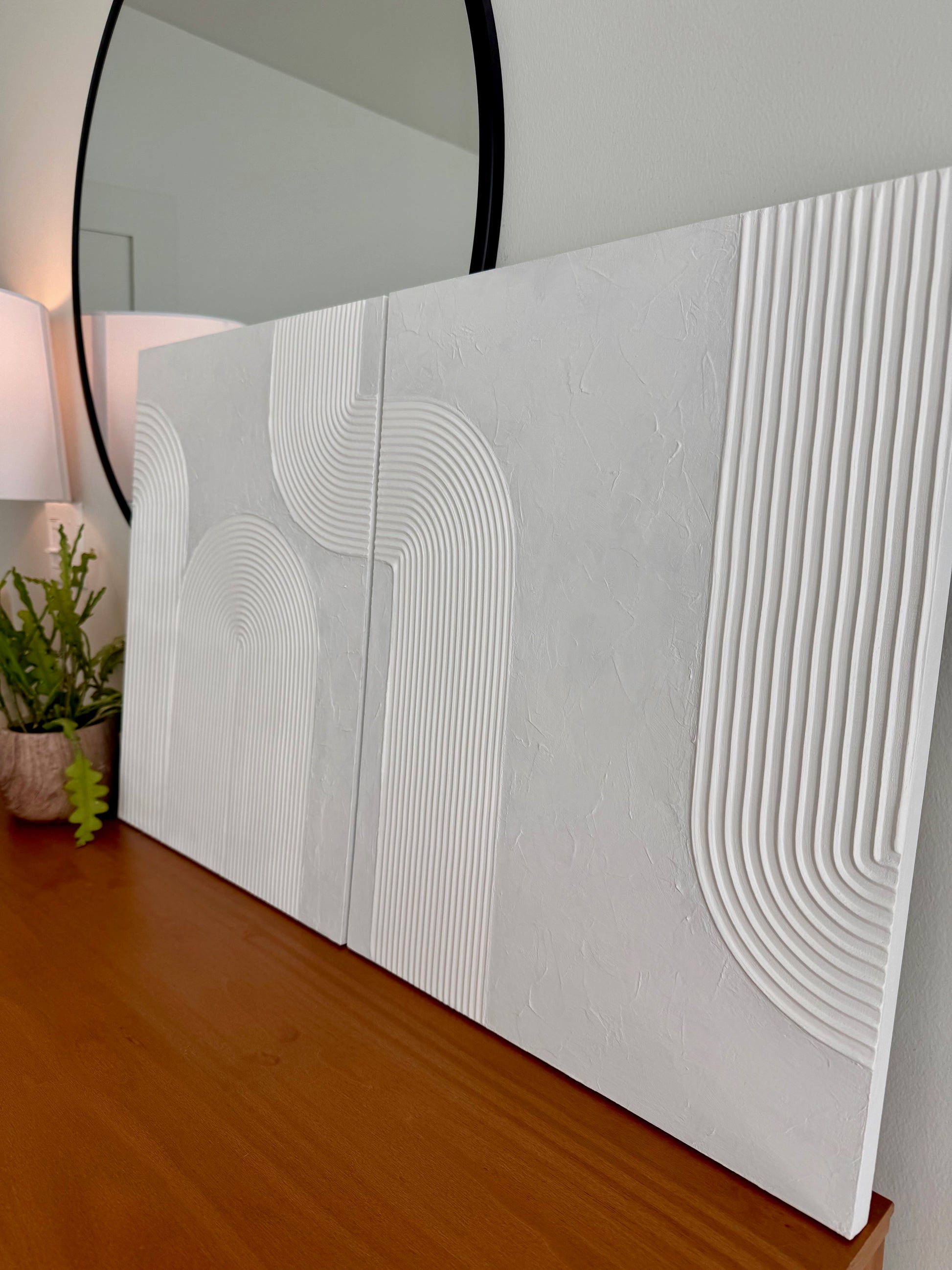Decorative wall panel with geometric pattern on a wooden surface