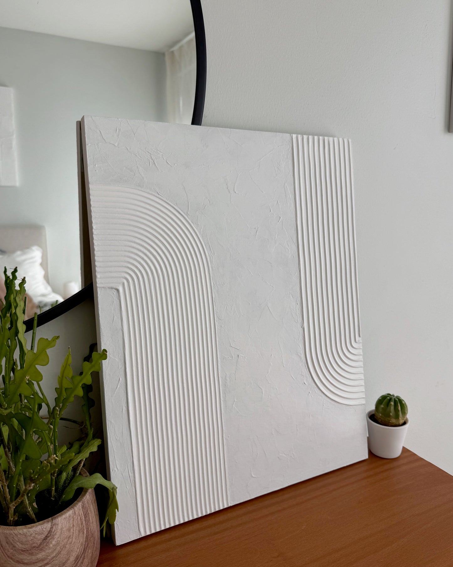 Decorative wall panel with geometric design on a wooden surface