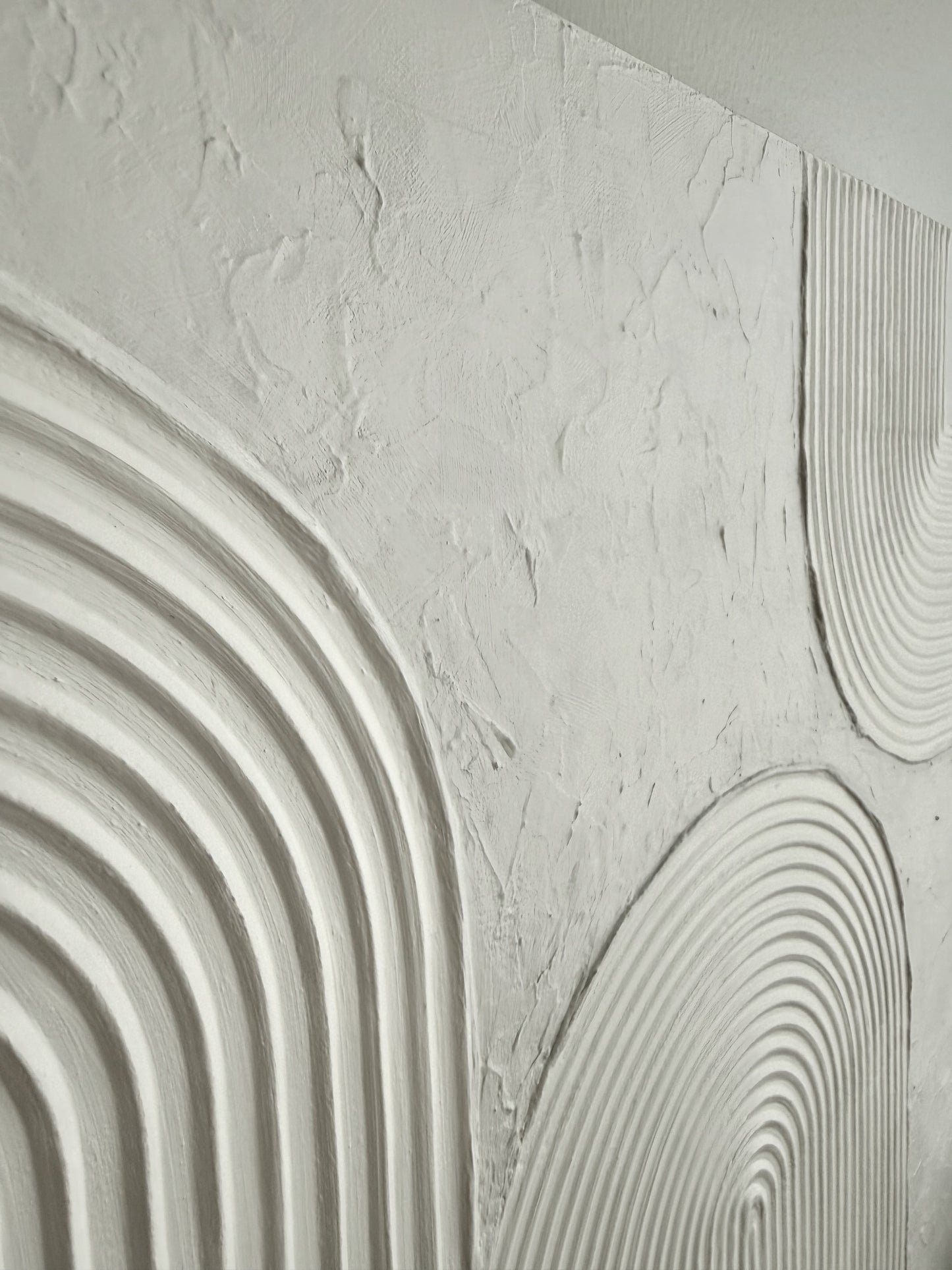 Close-up of textured wall panels with wavy patterns